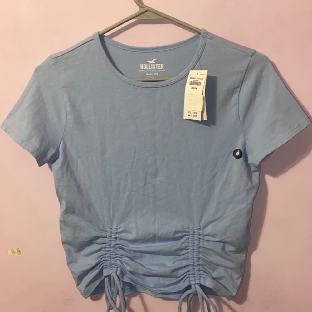 baby tee with ties on the bottom